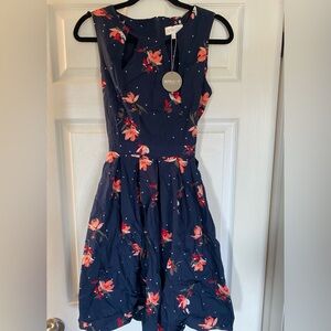 Fit and flare dress. Tie back. Bought in the UK.